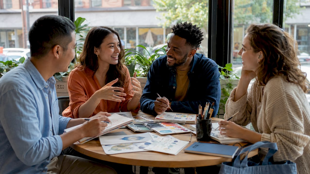 Diverse group connecting over art at community center